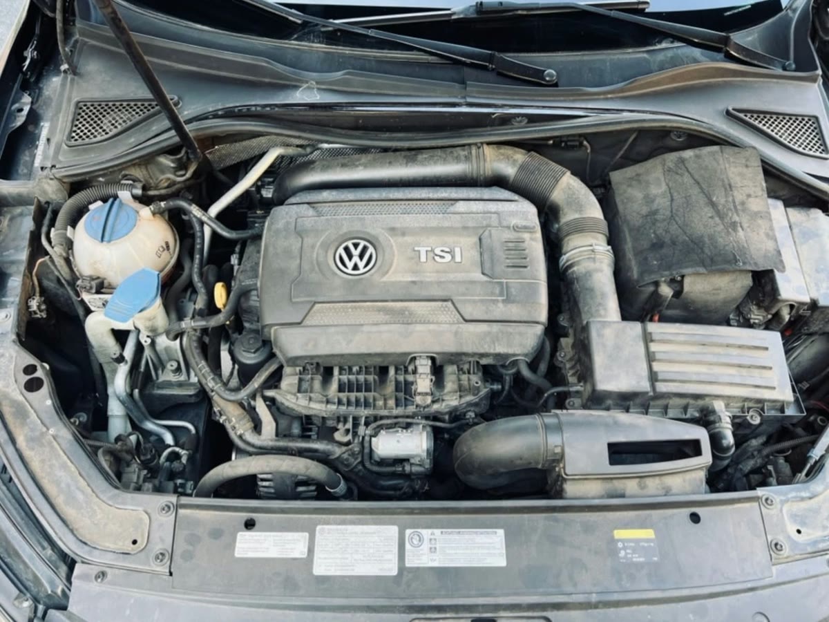 Volkswagen engine bay before a detail, dusty and dull